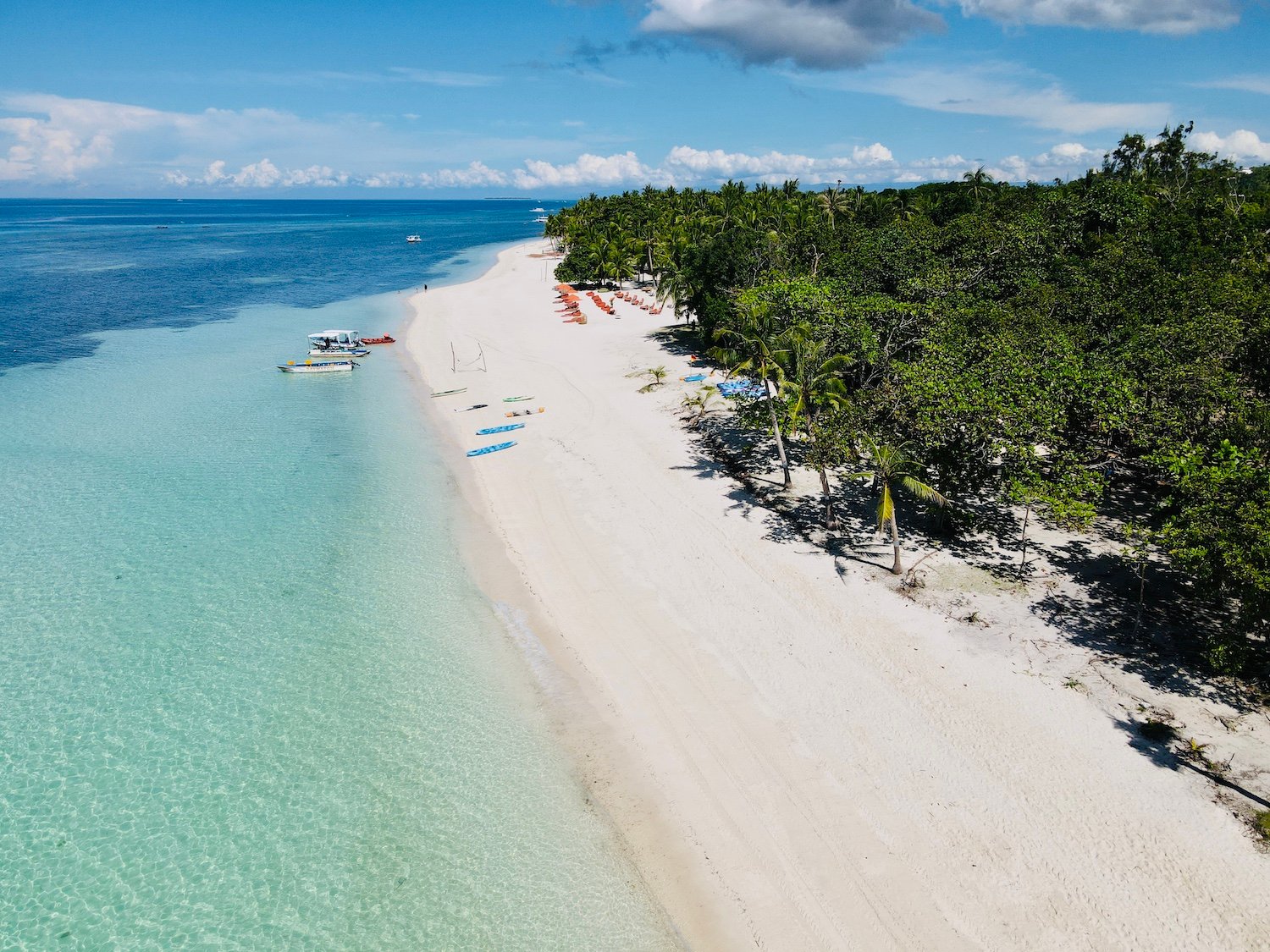 4.Dumaluan Beach: Where white sand meets crystal waters